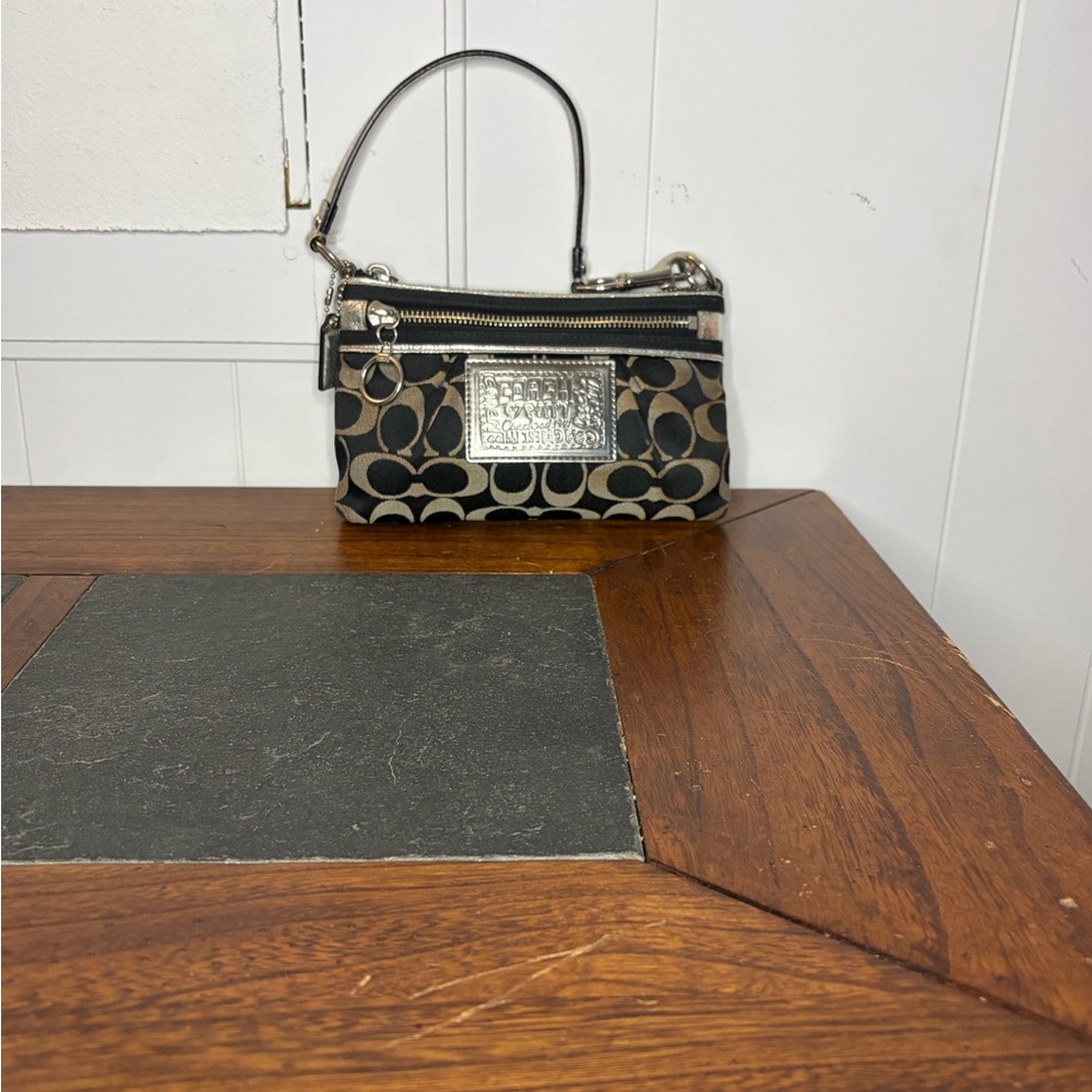 Coach Poppy Black and Tan Signature Clutch